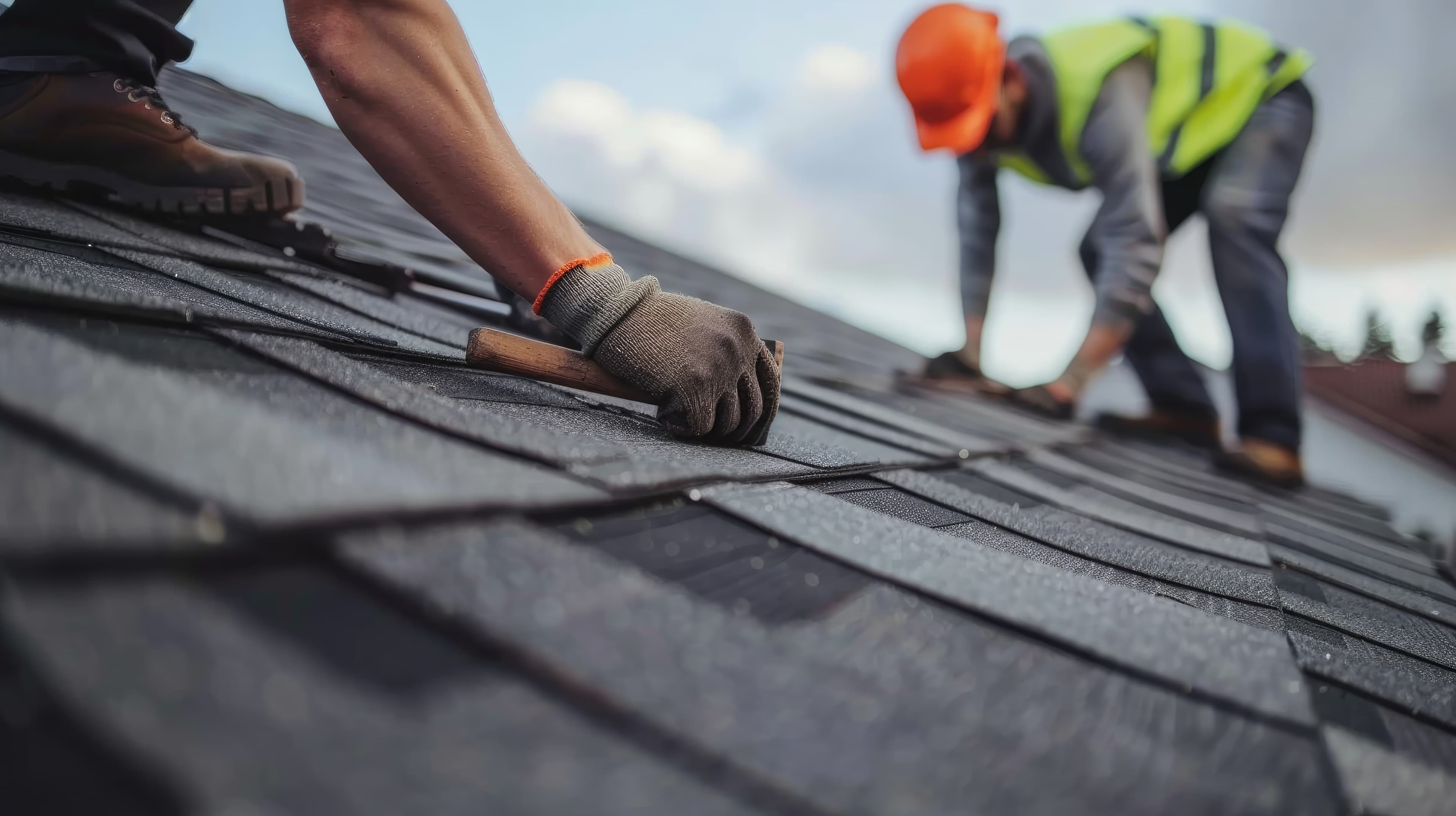 Contractor reviewing claim on tablet